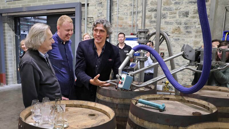 The first barrel containing malt whiskey made with barley harvested on the Slane Castle estate being filled at Slane Distillery last month. Slane Irish Whiskey co-founders Lord Henry Mount Charles (left) and Alex Conyngham (centre) with Alan Buckley, assistant distillery manager. Photograph: Marc O’Sullivan