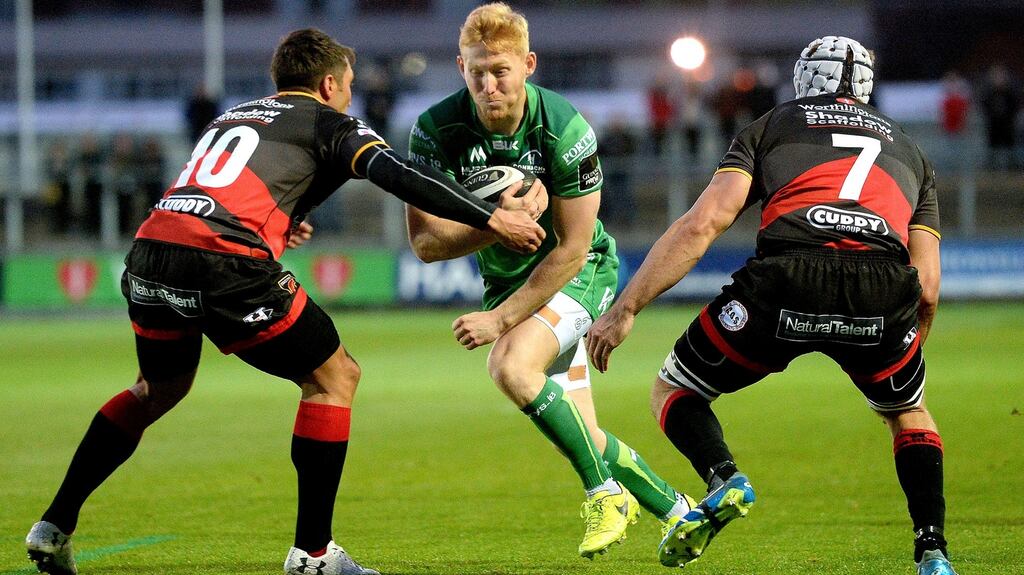 Connacht’s Rory Scholes is tackled by  Gavin Henson of the Dragons during the Guinness Pro 14 game  at Rodney Parade. Photograph: Ian Cook/Inpho