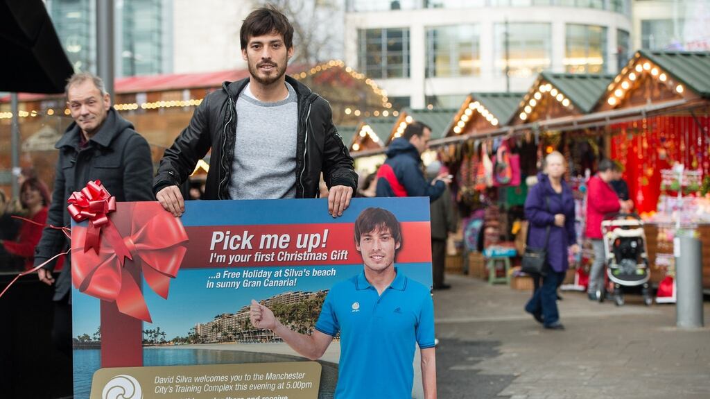 David Silva was unveiled as the club’s ‘secret santa’ as he gave out three holidays to the Anfi resort in Gran Canaria to surprised Manchester residents. Photograph:PA