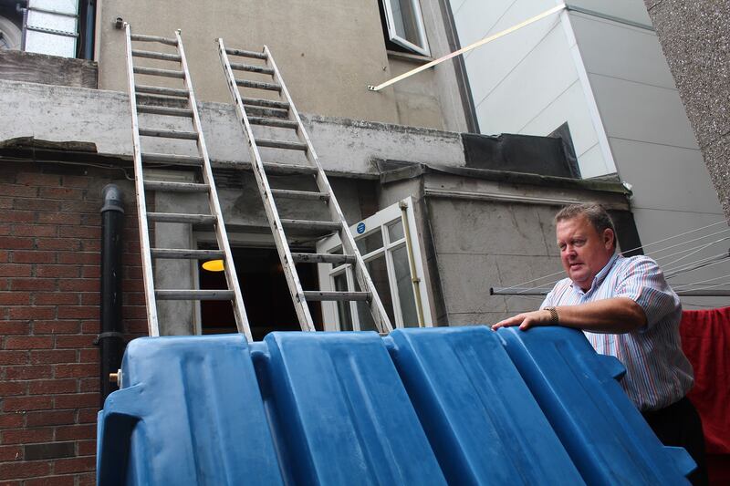 Martin McGowan, owner of Scholars Townhouse Hotel in Drogheda, with a new water tank he is installing in his hotel to cope with the water crisis.
Photograph: Simon Carswell