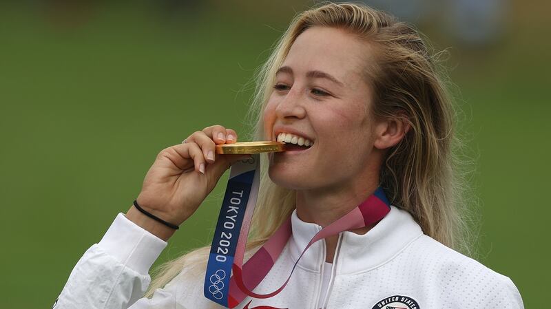 Nelly Korda celebrates with her gold medal after winning at the Tokyo Olympics. Photograph: Mike Ehrmann/Getty Images