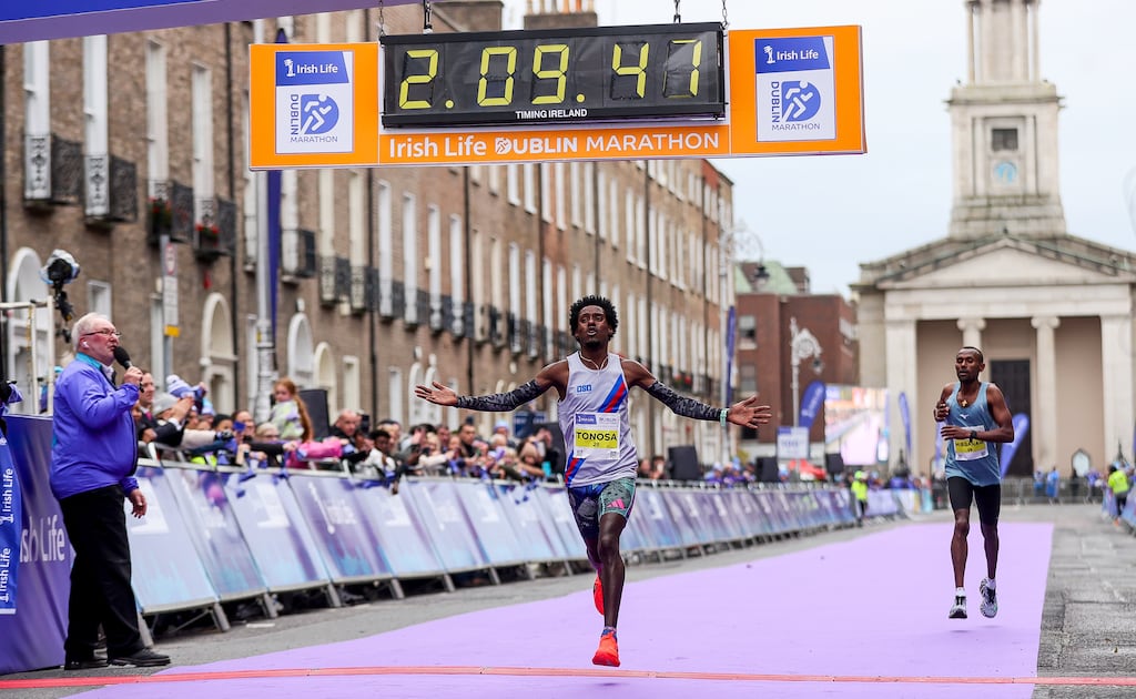 Hiko Tonosa celebrates setting a new Irish marathon record at the 2024 Irish Life Dublin Marathon, but how does it compare to John Treacy's 1984 run at the Boston Marathon? Photograph: ©INPHO/Ben Brady