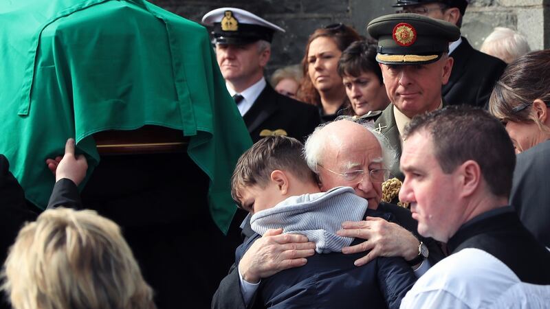 President Michael D Higgins embraces Fionn, the son of Capt Mark Duffy, at St Oliver Plunkett Church, Blackrock, Co Louth, this morning, at his funeral. Photograph: Colin Keegan/Collins Dublin