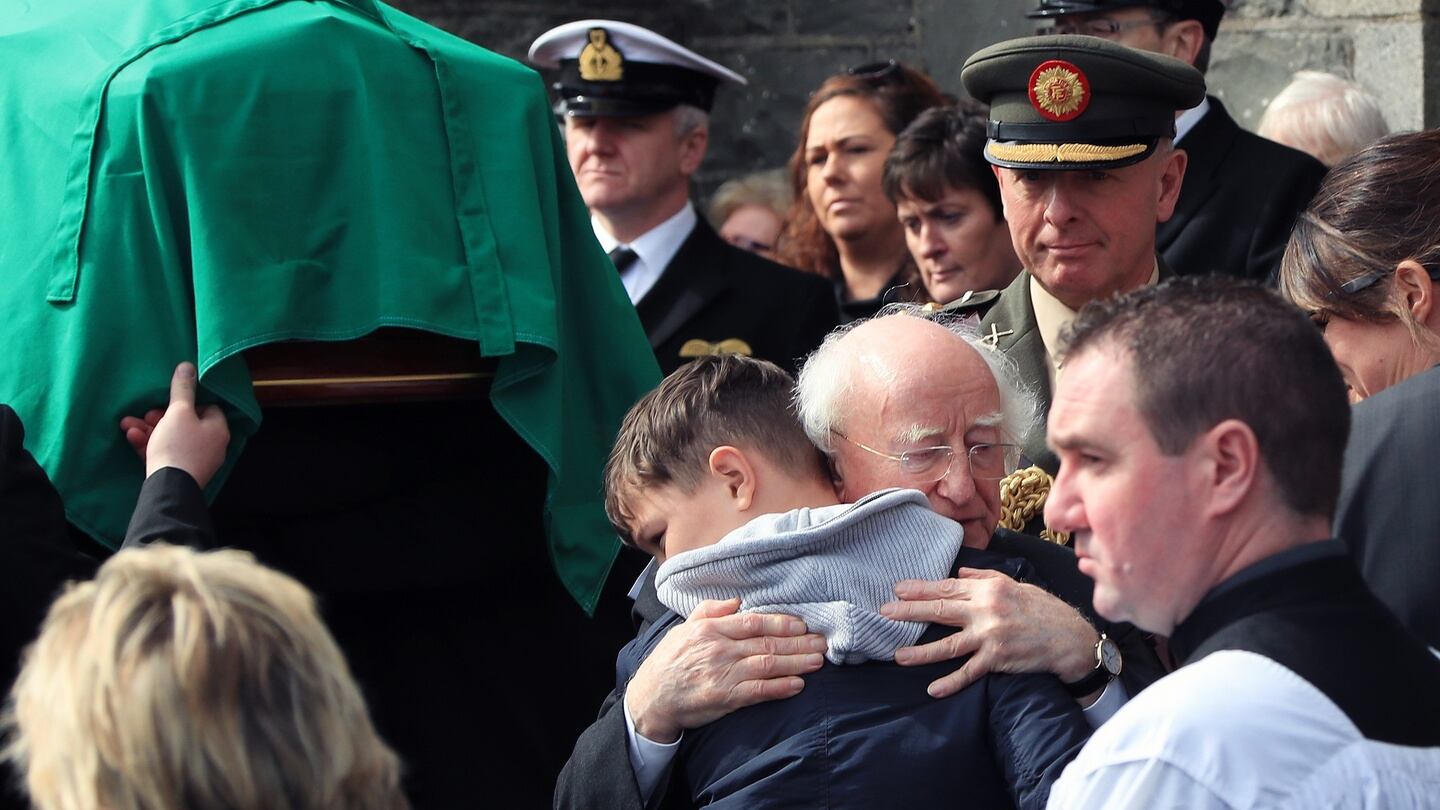 President Michael D Higgins embraces Fionn, the son of Capt Mark Duffy, at St Oliver Plunkett Church, Blackrock, Co Louth, this morning, at his funeral. Photograph: Colin Keegan/Collins Dublin