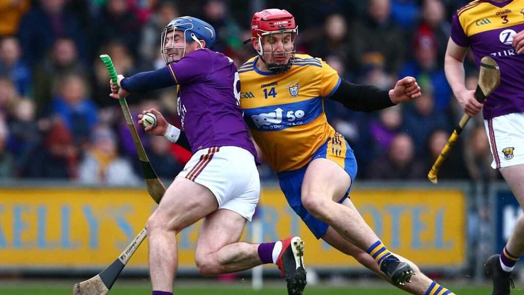 Wexford’s Kevin Foley is challenged byClare’s John Conlon during the Allianz Hurling League Division 1B game at Chadwicks Wexford Park. Photograph: Tom O’Hanlon/Inpho