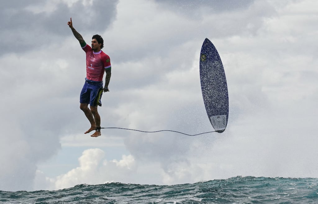 Brazil's Gabriel Medina celebrates after a large wave in the fifth heat of the men's surfing round three at the Paris 2024 Olympic Games in Teahupo'o, Tahiti. Photograph: Jérôme Brouillet/AFP via Getty Images