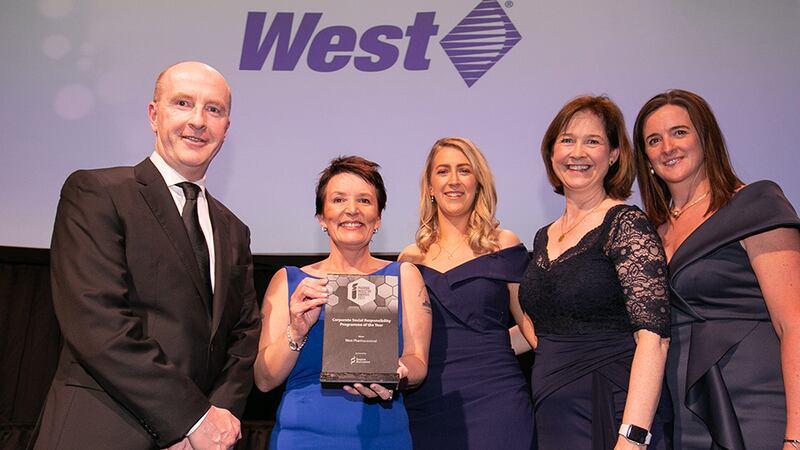 Maureen Gilbert, General Manager, Source BioScience Ireland, presents the Corporate Social Responsibility Programme of the Year award to the West Pharmaceutical team.