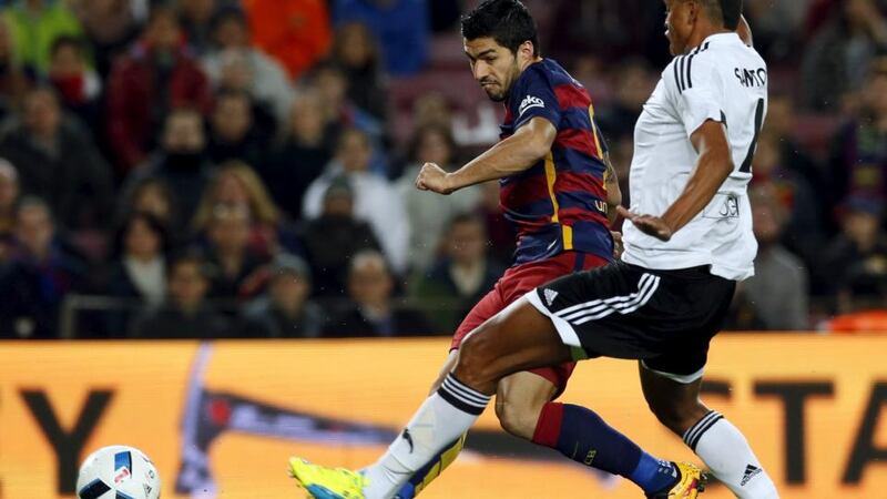 Barcelona striker Luis Suarez scores during the Copa del Rey semi-final first leg against Valencia at the Camp Nou. Photograph: Albert Gea/Reuters