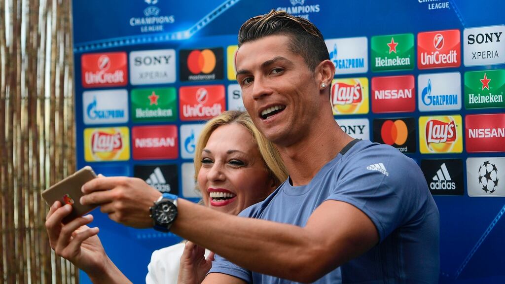 Real Madrid’s Cristiano Ronaldo takes a selfie with a journalist in the mixed zone ahead of Saturday’s Champions League final. Photo: Getty Images