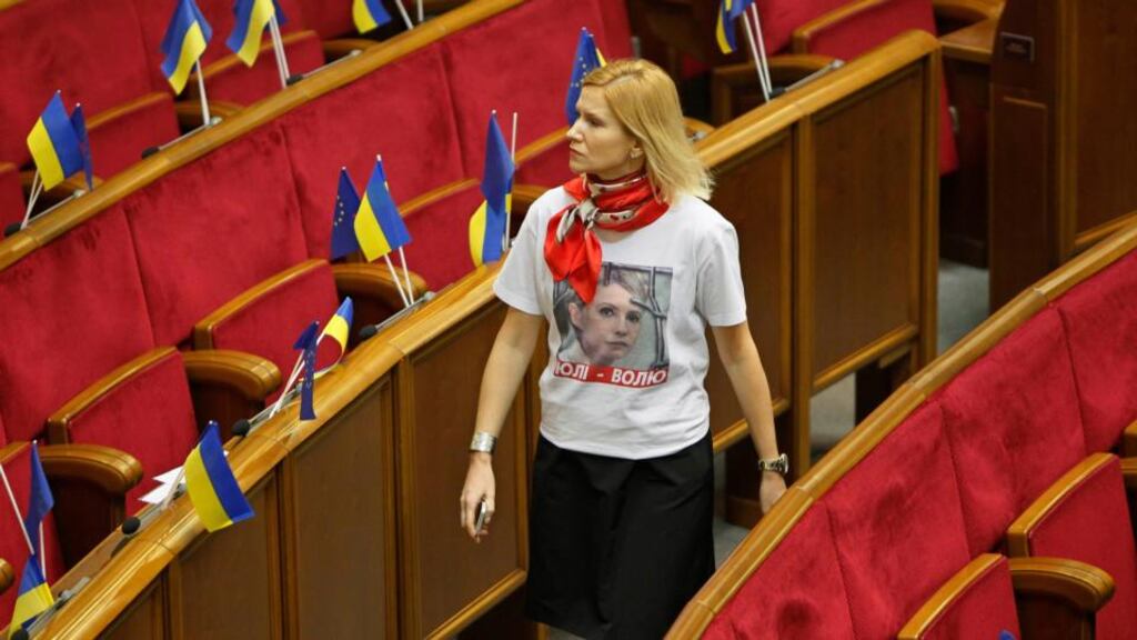 An opposition deputy, wearing a T-shirt in support of imprisoned former Ukrainian prime minister Yulia Tymoshenko, arrives at a session of parliament in Kiev. Photograph: Gleb Garanich/Reuters