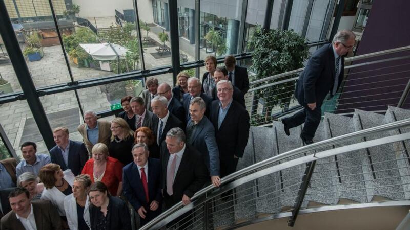 Had enough? Former Labour Leader Pat Rabbitte leaves the party group photograph a bit early during the party’s pre-autumn parliamentary meeting at White’s Hotel, Wexford. Photograph: Brenda Fitzsimons/The Irish Times