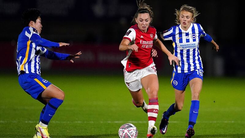 Katie McCabe goes past Lee Geum-Min and Ellie Brazil. Photo: John Walton/PA Wire