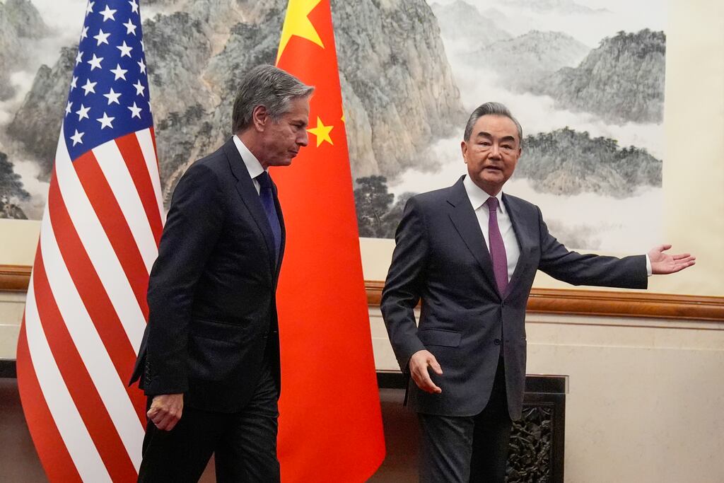 China’s foreign minister Wang Yi, right, gestures to US secretary of state Antony Blinken at the Diaoyutai State Guesthouse in Beijing, China. Photograph: Mark Schiefelbein, Pool/AP
