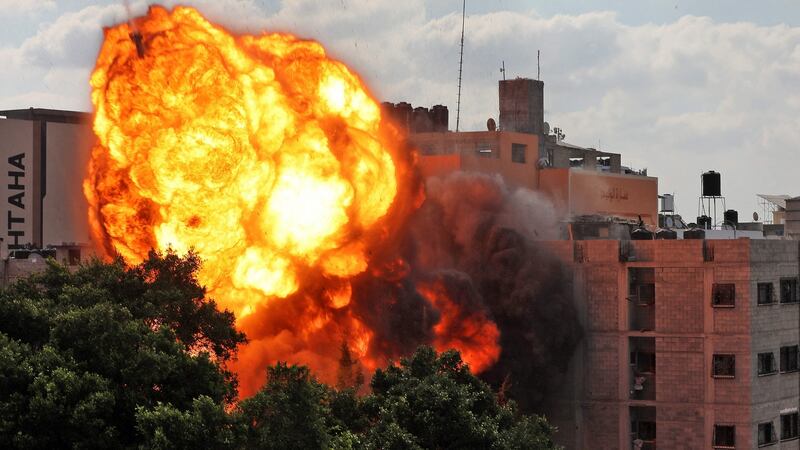 A ball of fire engulfing the Al-Walid building which was destroyed in an Israeli air strike on Gaza city early on Thursday. Photograph: AFP via Getty Images
