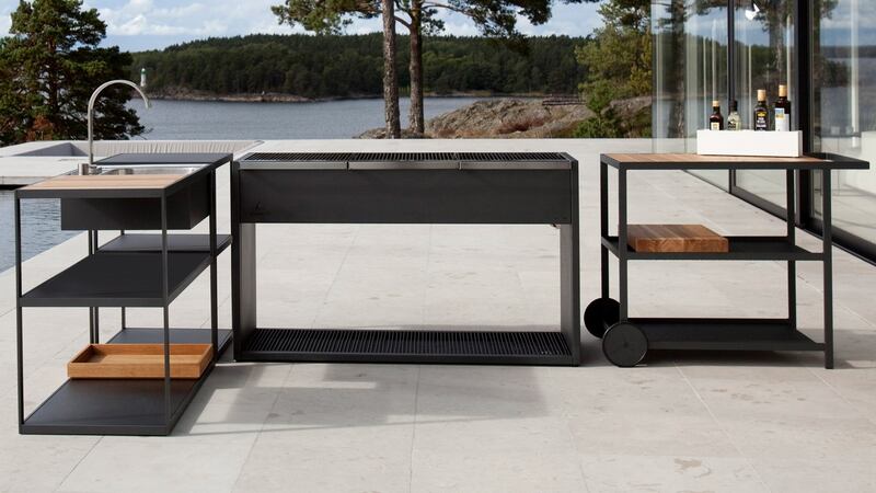 The Roshult is fabricated in an anthracite finish stainless steel and has teak shelving.