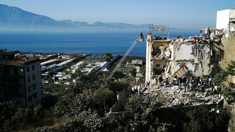Rescuers at work amid the rubble of a building that collapsed in Torre Annunziata. Photograph: EPA