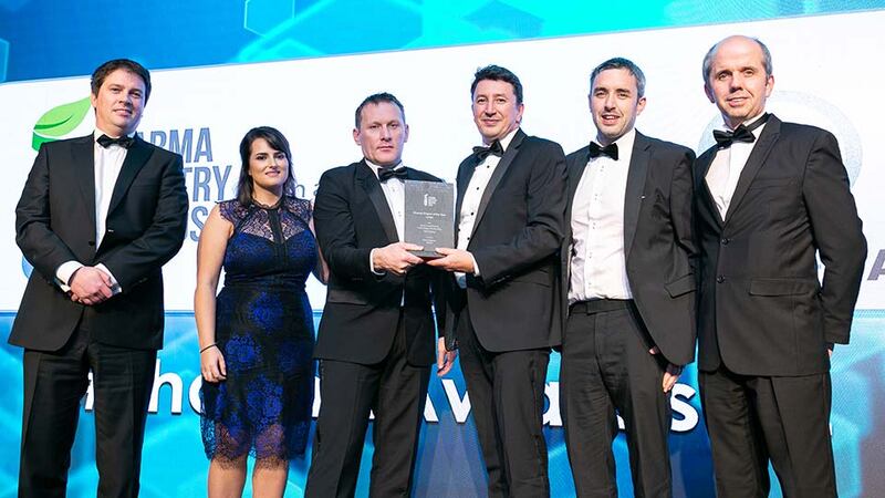 Aidan McCauley, MD, Dawsongroup Ireland presents the Pharma Project of the Year - Large award to the MSD Brinny team.