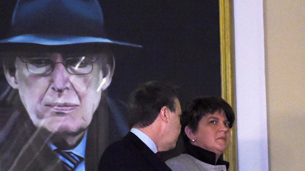 Democratic Unionist Party leader Arlene Foster before a portrait of Ian Paisley: Unionists should start by trusting the Government. Photograph: Clodagh Kilcoyne