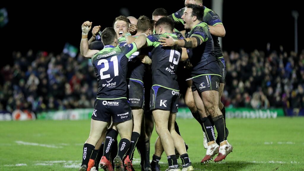Connacht players celebrate with Jack Carty at the end of the game. Photograph: Morgan Treacy/Inpho