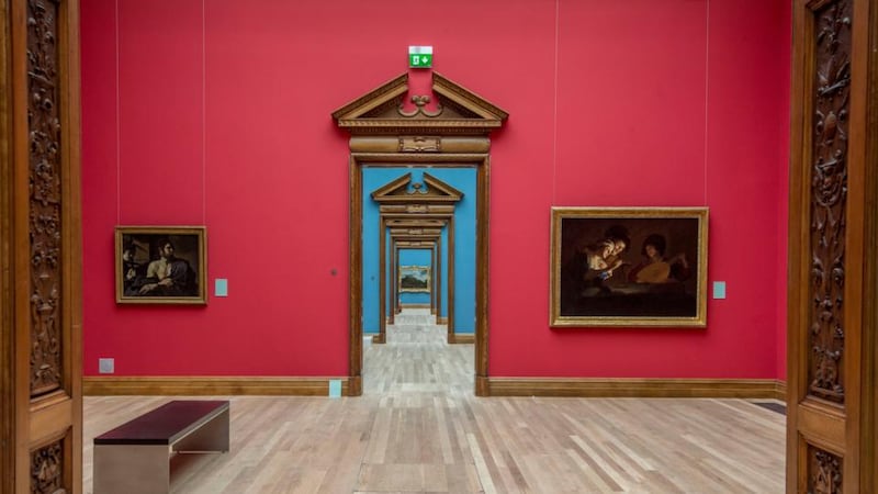 New-look National Gallery of Ireland: stripping back the walls has made the elaborate oak door frames of the Milltown Wing’s enfilade – its memorable succession of galleries, almost all now painted blue – even more prominent. Photograph: Brenda Fitzsimons