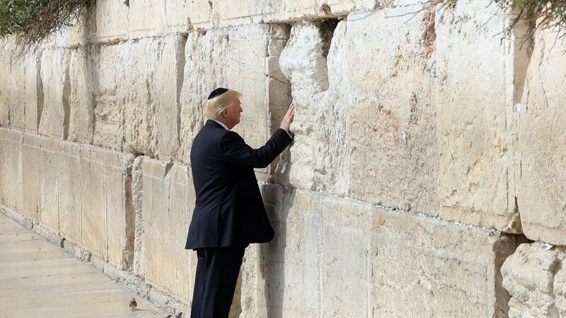 US president Donald Trump touches the Western Wall, Judaism’s holiest prayer site, in Jerusalem’s Old City, on May 22nd, 2017. File photograph: Ronen Zvulun/EPA