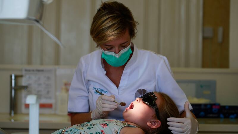 Dentist Gillian Smith with patient Millie Byrne. Photograph: Nick Bradshaw