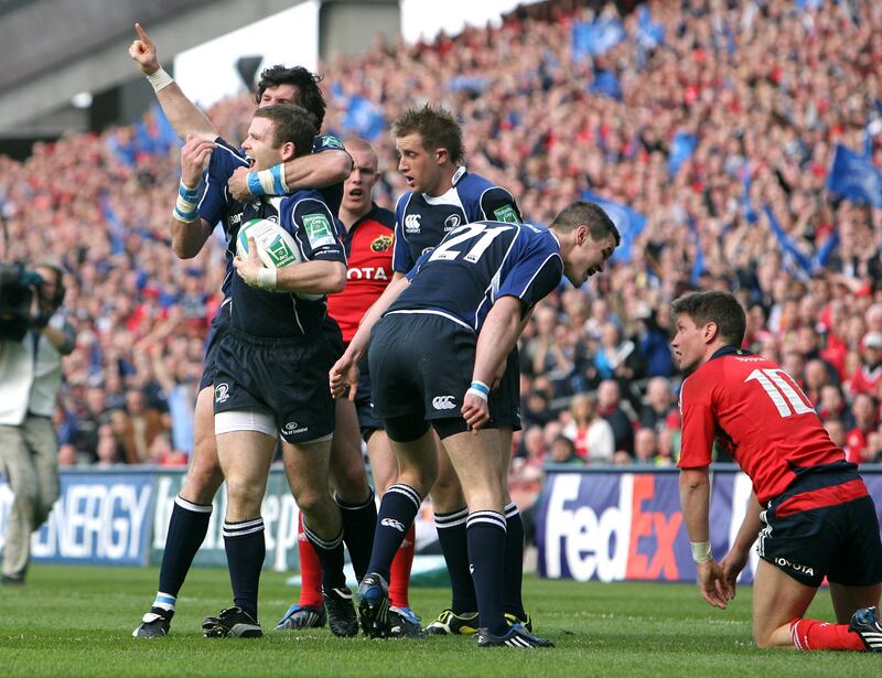 Johnny Sexton shares some thoughts with Ronan O'Gara as Gordon D'Arcy and Shane Horgan celebrate a Leinster try against Munster in the 2009 Heineken Cup semi-final. Photograph: James Crombie/Inpho