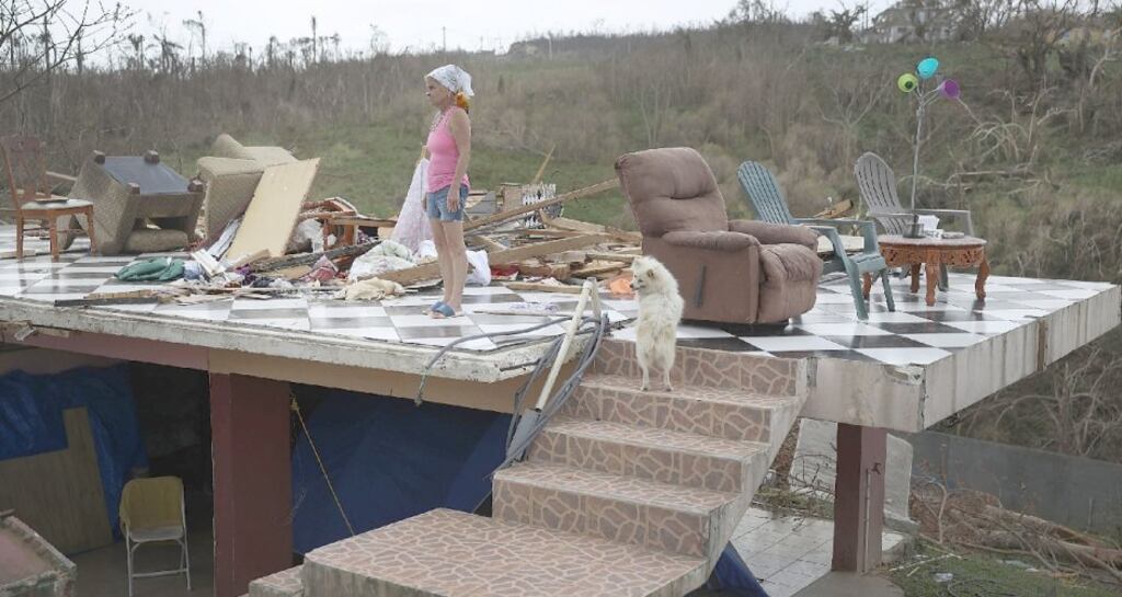 Irma Maldanado stands with her pets in what is left of her home after Hurricane Maria hit Puerto Rico. Photograph: Joe Raedle/Getty Images