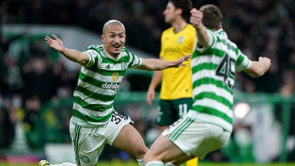 Celtic’s Daizen Maeda celebrates with James Forrest after scoring his side’s opening goal in the Scottish Premiership match against Hibernian at Celtic Park. Photograph: Andrew Milligan/PA Wire