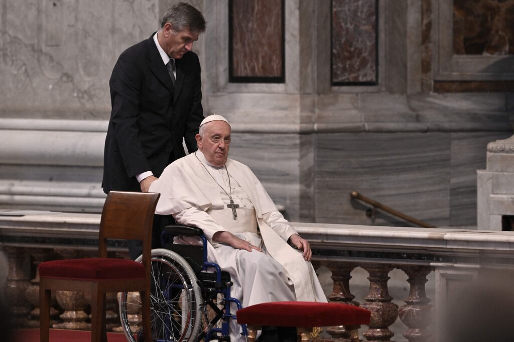 Pope Francis leaves St Peter's basilica on a wheelchair after a mass for the closing of the 16th general assembly of the synod of bishops on October 29th, 2023 in The Vatican. Photo by Tiziana Fabi/AFP via Getty Images