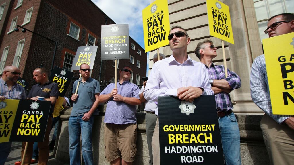 Members of the Garda Representative Association protest outside Government Buildings at the Department of Public Expenditure and Reform against the Government’s public pay cuts. Photograph: The Irish Times
