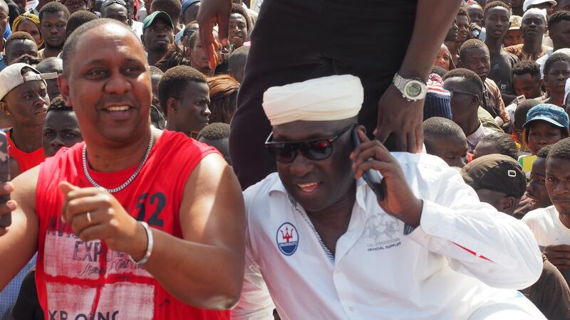 Braima Camara (R) with blogger Daniel Ferreira, a fervent supporter of the grupo dos quinze (L) at demo against sanctions. Photograph: Lorraine Mallinder