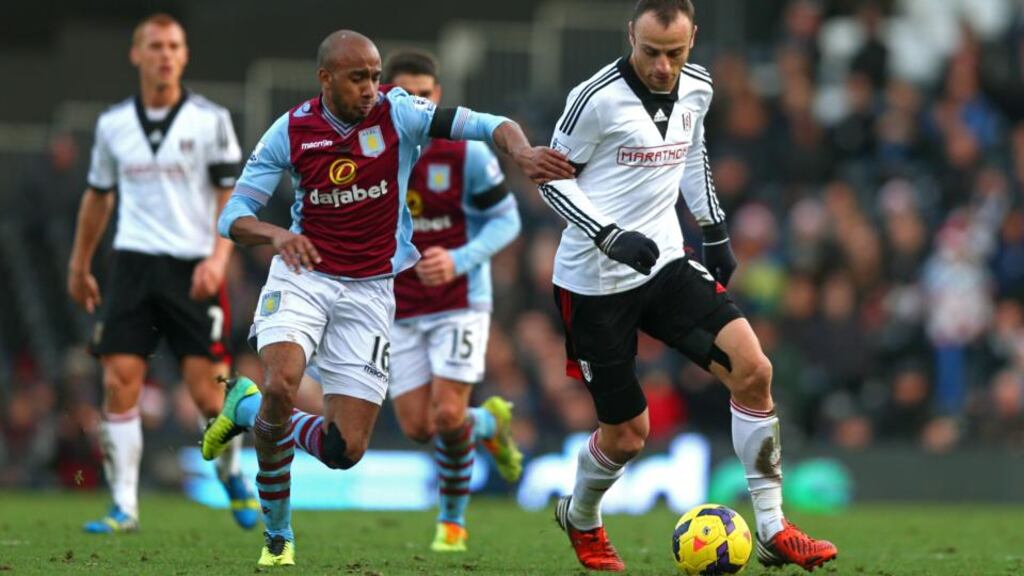 Fulham’s Dimitar Berbatov in action against Fabian Delph of Aston Villa at Craven Cottage during the Premier League clash. Photo: Paul Gilham/Getty Images