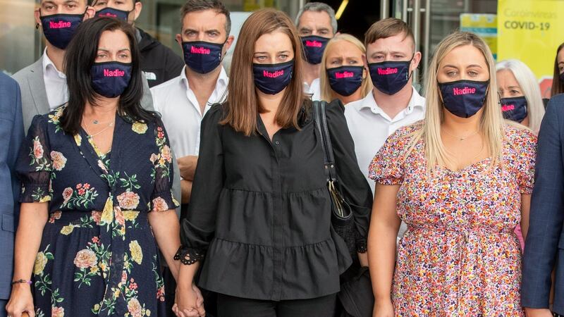 (Left to right) Claire Lott, Tanith Lott and Phoebe Lott, Nadine Lott’s mother and sisters, are pictured with other family members and friends outside the Criminal Courts of Justice in Dublin following Daniel Murtagh’s conviction for Nadine’s murder. Photograph: Collins Courts.