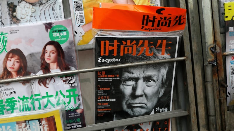 US president Donald Trump on the cover of a Chinese fashion magazine at a news stand in Beijing. Photograph: How Hwee Young/EPA