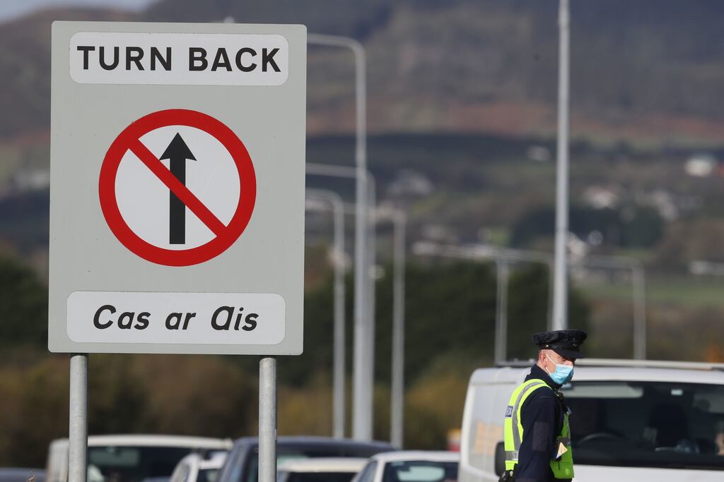 Gardai at the border crossing between Northern Ireland and the Republic of Ireland, as they conduct checks asking people the reason for their journey. PA Photo. Picture date: Friday October 23, 2020. Residents in the Republic of Ireland are living with Level 5 lockdown measures restricting them to within a 5km radius of their homes, with only essential workers permitted to travel to work. Residents north of the border are in the first week of a four-week circuit-break with no restriction on travel but guidance against taking unnecessary journeys. See PA story IRISH Coronavirus. Photo credit should read: Brian Lawless/PA Wire