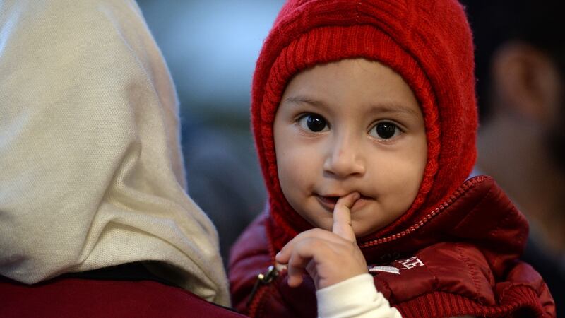 Samir Youzbashi Aljafari and his wife Wafaa’s grandson Yousef: the couple met the one-year-old for the first time in Dublin Airport on Monday. Photograph: Dara Mac Donaill