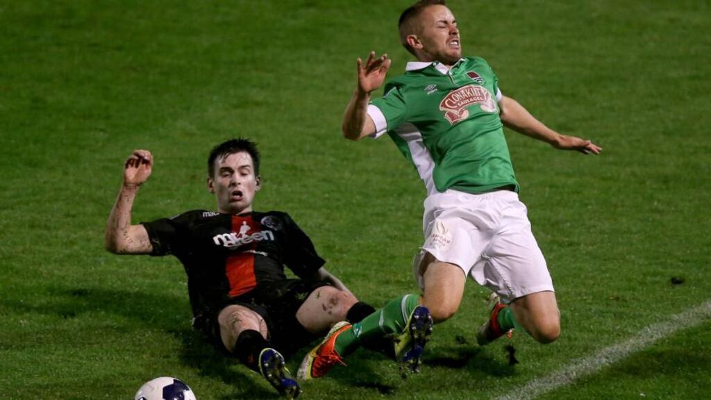 Cork City’s Liam Kearney has the ball nicked off him by Karl Moore of Bohemian at Dalynount Park. Photograph: Donall Farmer/Inpho
