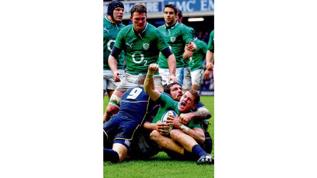 Craig Gilroy barges over the line to score the only try of the Six Nations game between Scotland and Ireland at Murrayfield yesterday. Gilroy could have another try but Luke Marshall's pass couldn't find him. Photograph: Stu Forster/Getty Images