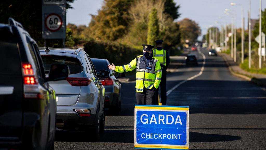 Members of An Garda at a checkpoint on the R173 in Co. Louth at the Loughanmore area close to Carlingford. The Garda have set up 132 checkpoints as part of Operation Fanacht, which is aimed at encouraging the public to adhere to health guidelines. Liam McBurney/PA Wire