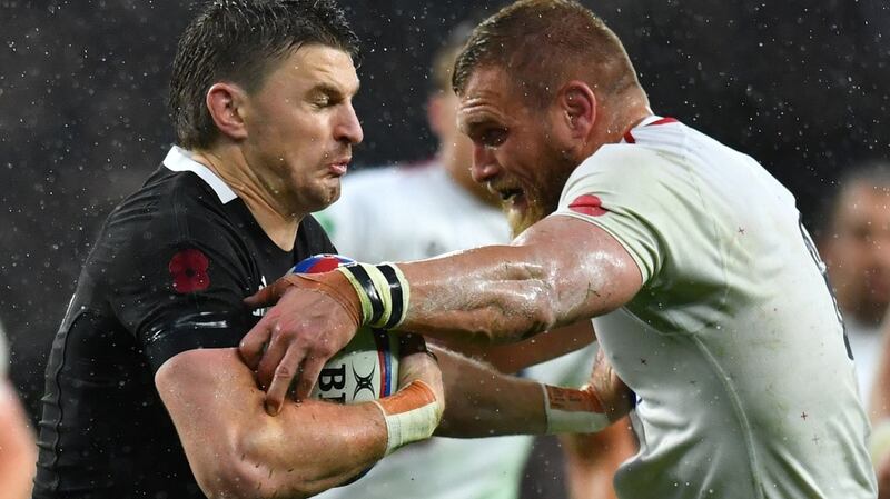 England’s Brad Shields tackles his former New Zealand Under-20 teammate Beauden Barrett. Photograph: Dylan Martinez/Reuters