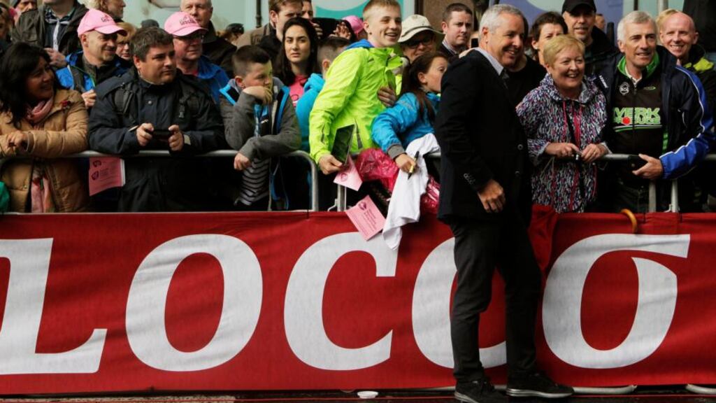 Stephen Roche, the first Irishman to win the Giro d’Italia, poses for photographs at the finish line of Stage Two of the 2014 Giro in Belfast. Photo: Brian Lawless/PA