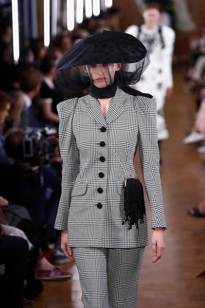 Erdem mixed wild and flouncy with sharper shapes, showing how veiling can dramatise a suit. Photograph: Getty Images