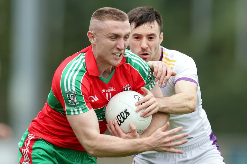 Ballymun Kickhams' Paddy Small and Aidan Jones of Kilmacud Crokes in their Dublin senior football championship quarter-final in Parnell Park, Dublin. Photograph: Laszlo Geczo/Inpho
