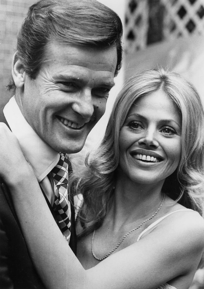 Britt Ekland with Roger Moore, who she acted with in the James Bond film The Man with the Golden Gun, in 1974. File photograph: Central Press/Getty Images