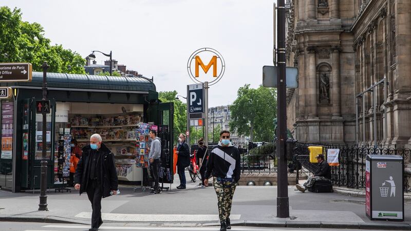 Pedestrians near the  Métro station on Rue de Rivoli in Paris on Monday as France begins easing lockdown. Photograph: Adrienne Surprenant/Bloomberg