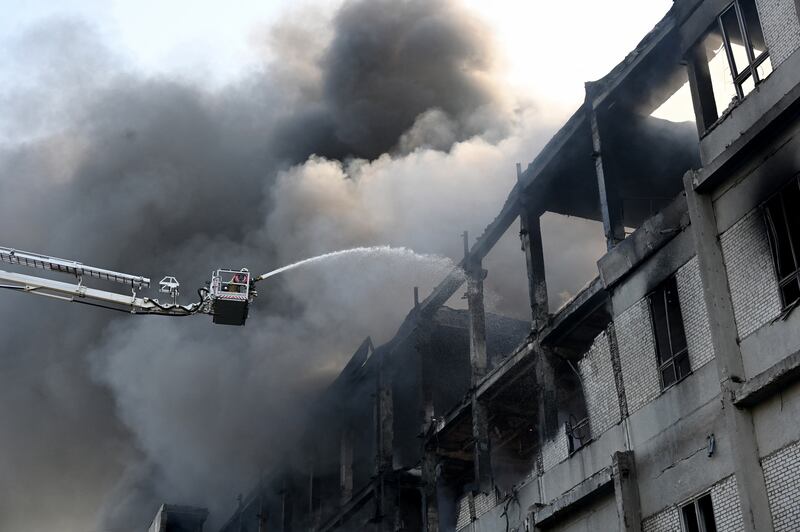 A firefighter battles a blaze at a civilian plant in Kharkiv following Russian strikes. Photograph: Getty Images
