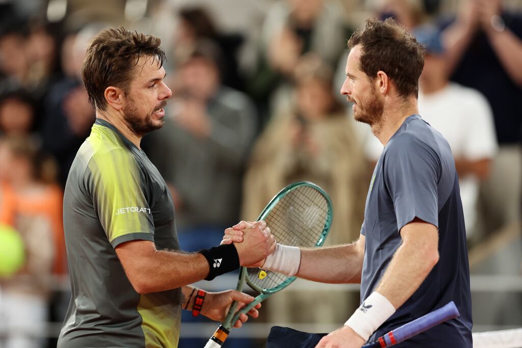 Stan Wawrinka and Andy Murray embrace at the net. Photograph: Clive Brunskill/Getty