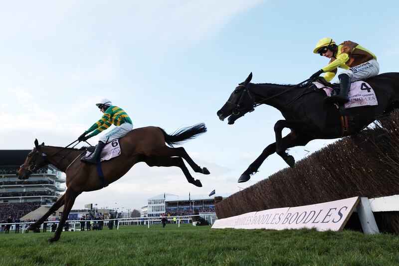 Mark Walsh riding Inothewayurthinkin clears the last fence from Paul Townend riding Galopin des Champs to win the Cheltenham Gold Cup Chase on March 14th. Photograph: Michael Steele/Getty Images