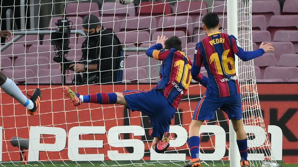 Barcelona’s Lionel Messi scores their first goal in the draw with Valencia. Photo: Lluis Gene/AFP via Getty Images